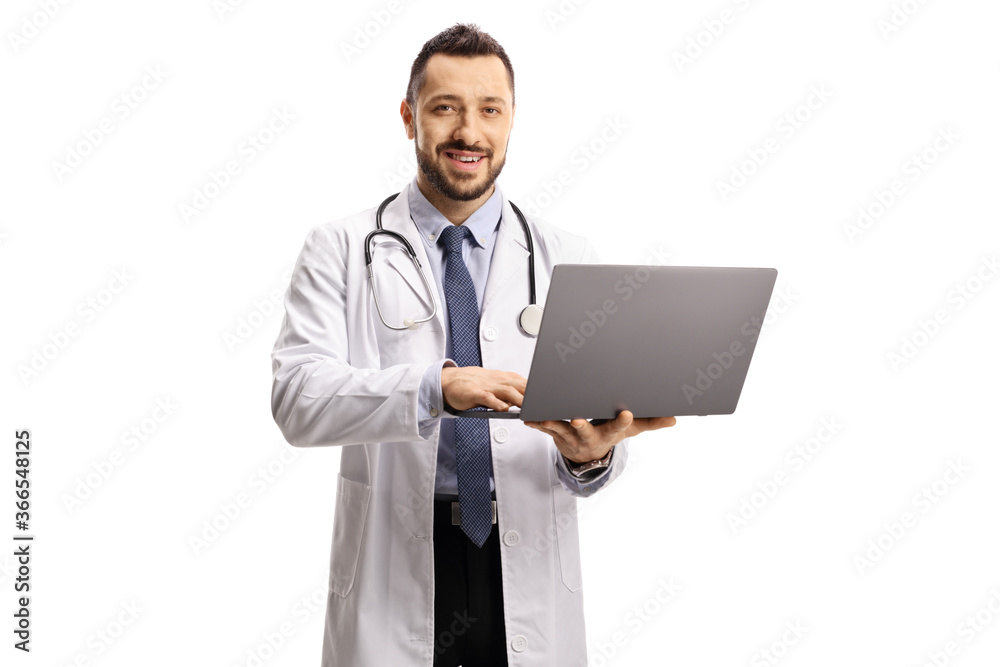 Male doctor holding a laptop and looking at the camera