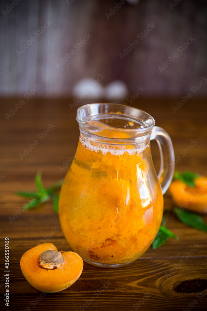 cold apricot compote in a glass decanter cold apricot compote in a glass decanter