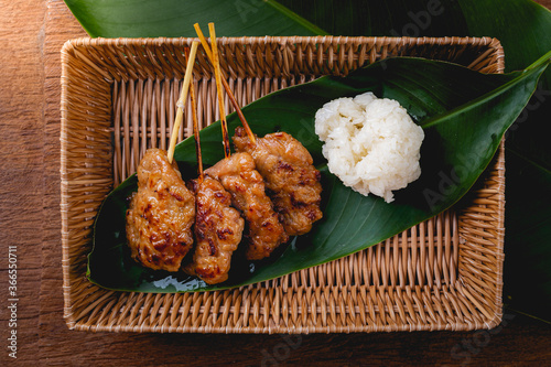 Top view of Grilled pork with sticky rice, Thai  street food photo