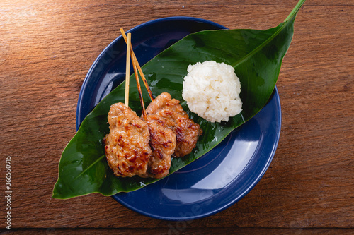 Top view of Grilled pork with sticky rice, Thai street food photo