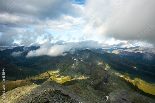Fototapeta Naklejka Na Ścianę i Meble -  Amazing mountain landscape with colorful sky. Travel and hiking concept. Mountain landscape Subpolar Ural view from Mount Manaraga. Queen of the Ural Mountains.