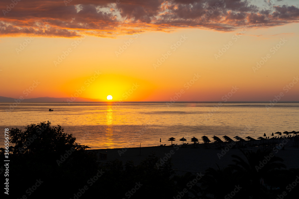 Magical sunrise over sea and beach in Greece