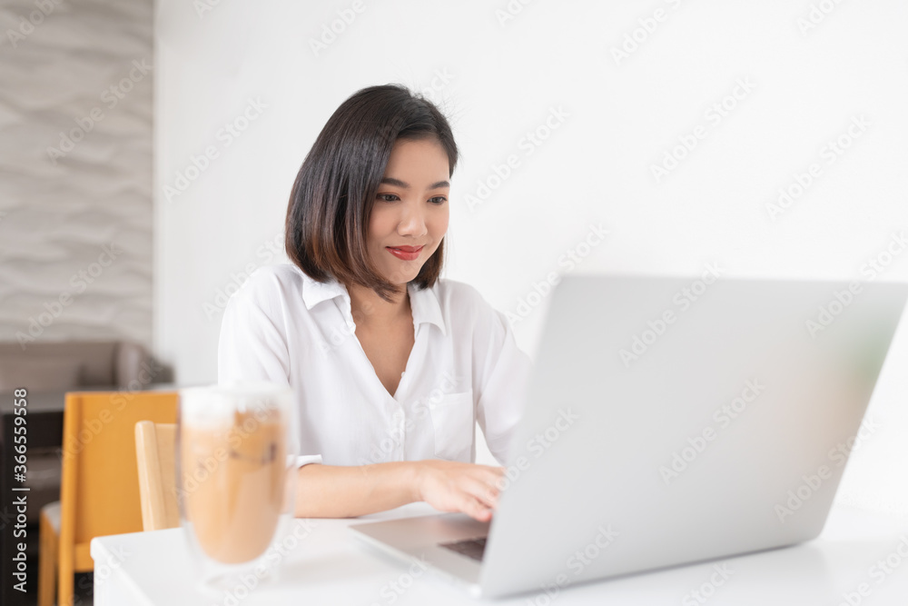 Asian business lady working in a random cafe Asian business lady working in a random cafe