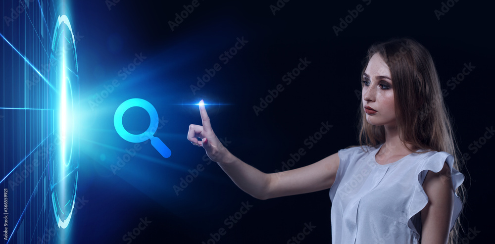 Business, Technology, Internet and network concept. Young businessman working on a virtual screen of the future and sees the inscription: Business, Technology, Internet and network concept. Young businessman working on a virtual screen of the future and sees the inscription:
