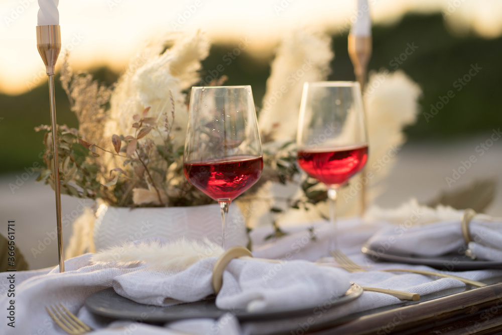 beautifully decorated table with glasses, plates, forks