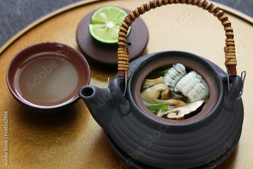 dobin mushi (Japanese cuisine) : steamed matsutake mushroom and pike conger with Japanese broth in an earthenware teapot and served.
 photo