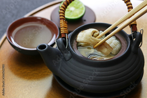 dobin mushi (Japanese cuisine) : steamed matsutake mushroom and pike conger with Japanese broth in an earthenware teapot and served.
 photo