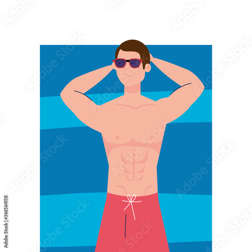view aerial, man in shorts lying down, tanning on towel, summer vacation season