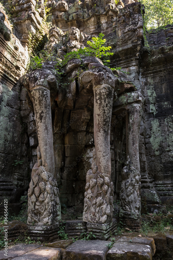 Ancient beautiful carved structures and gateways at Angkor Wat temples Cambodia