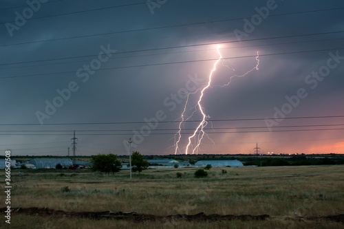 Lightning struck a field during a thunderstorm in the evening