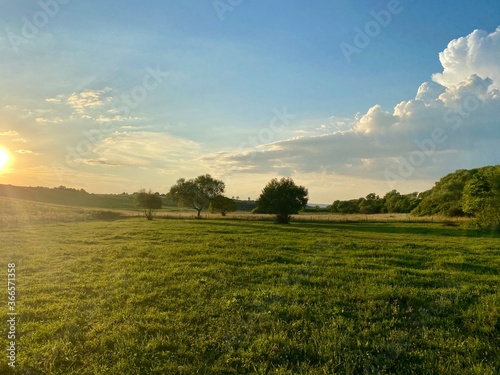 Romanian countryside with trees and clouds