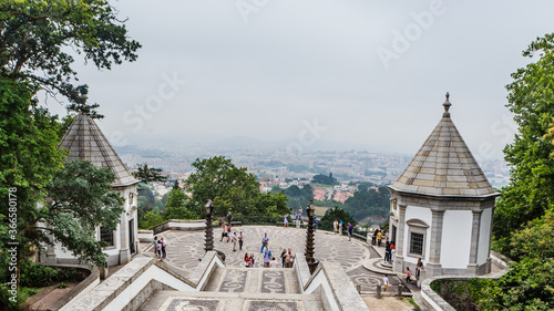 The monumental baroque staircase of Bom Jesus do Monte Sanctuary, a popular pilgrimage destination with panoramic views overlooking Braga cityscape from top of mountain.