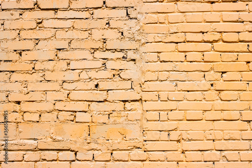 Brickwork background. Brick wall texture. Sloppy brick masonry of orange color.