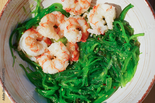 shrimp with hiyashi wakme chukka salads on a plate