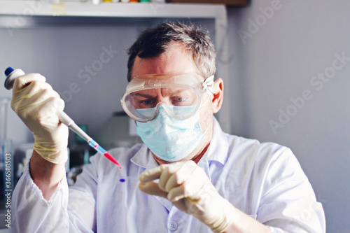 scientist in mask  in laboratory