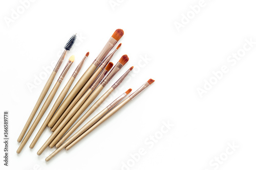 Makeup brushes on white background top view