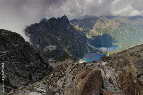 Gorgeous landscape with high peaks, stone cliffs in mountain and view of the Blake lake, or the Morskie Oko lake in a valley.Popular tourist destination in Zakopane,Poland. Tatra National Park.Europe.