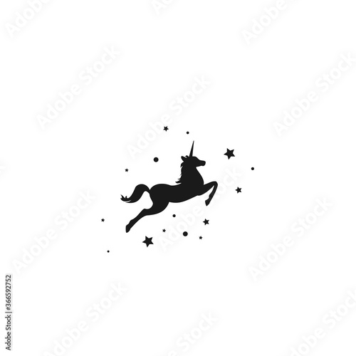 Black silhouette of graceful unicorn and stars. Fairy tale symbol.