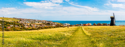 Billede på lærred A panorama down Beacon Hill towards the town of Rottingdean, Sussex, UK in summe