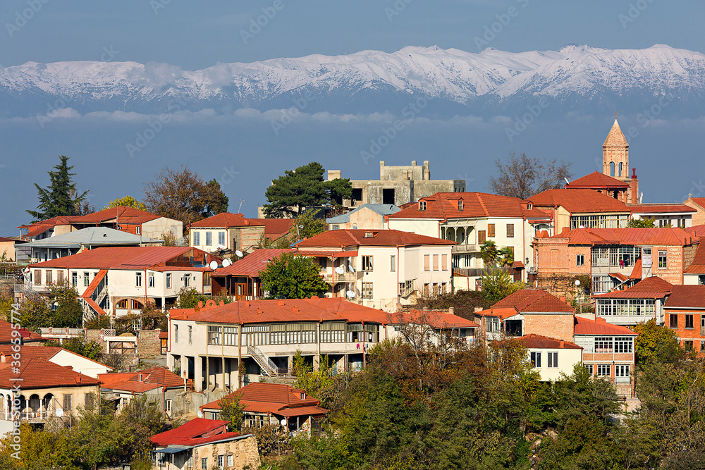 Old town Sighnaghi, in Kakheti region, with the Caucasus Mountains in the background, Georgia