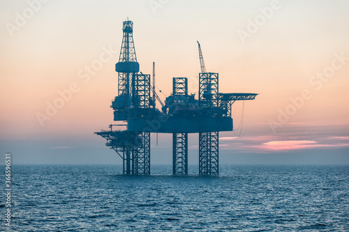 Offshore oil rig at sunset
