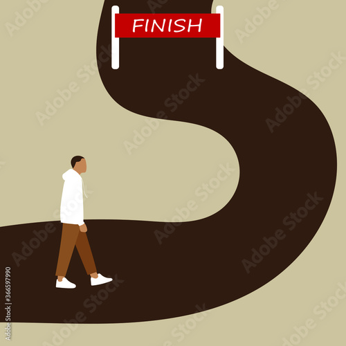 A man goes along the road to the finish sign