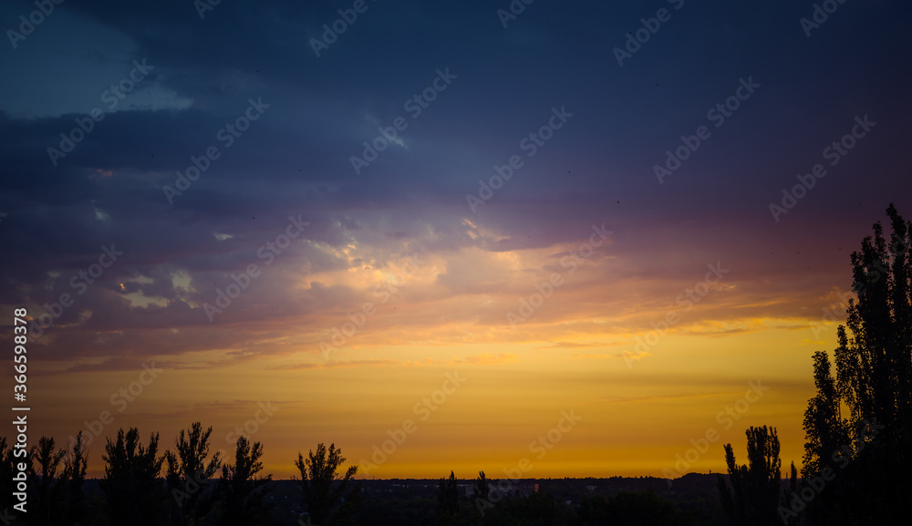 Landscape with dramatic light - beautiful golden sunset with saturated sky and clouds. Landscape with dramatic light - beautiful golden sunset with saturated sky and clouds.