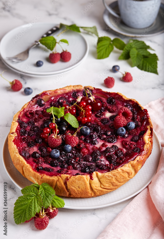 Cheesecake backed with berry mix on the top: cherries, raspberries, blueberries, red currant and blackcurrant. Delicious summer homemade dessert. Cheesecake backed with berry mix on the top: cherries, raspberries, blueberries, red currant and blackcurrant. Delicious summer homemade dessert.