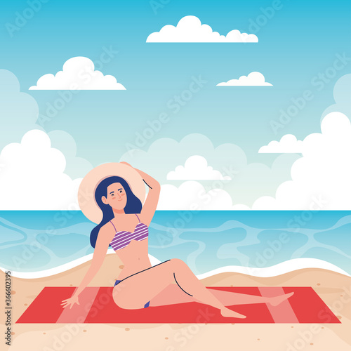woman with swimsuit sitting on the towel, in the beach, holiday vacation season © Gstudio