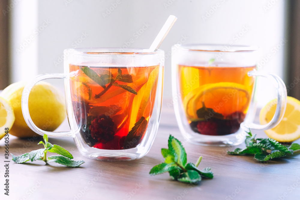 two glass cups tea with lemon slices and mint two glass cups tea with lemon slices and mint