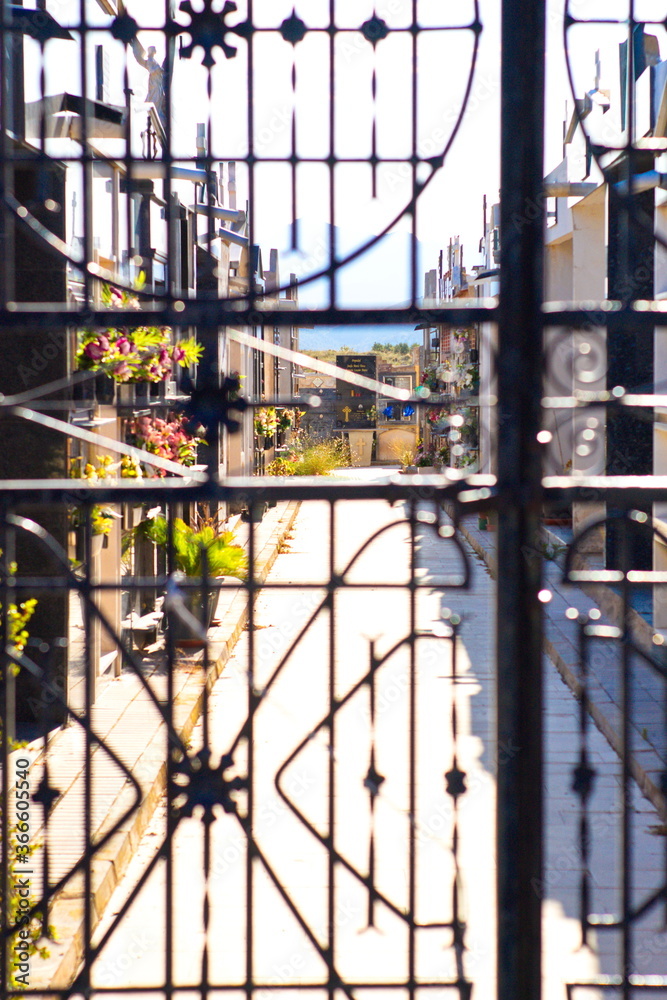 latticed entrance gate to a village cemetery latticed entrance gate to a village cemetery