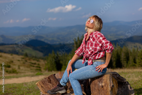 cute girl in denim clothes in the carpathian mountains