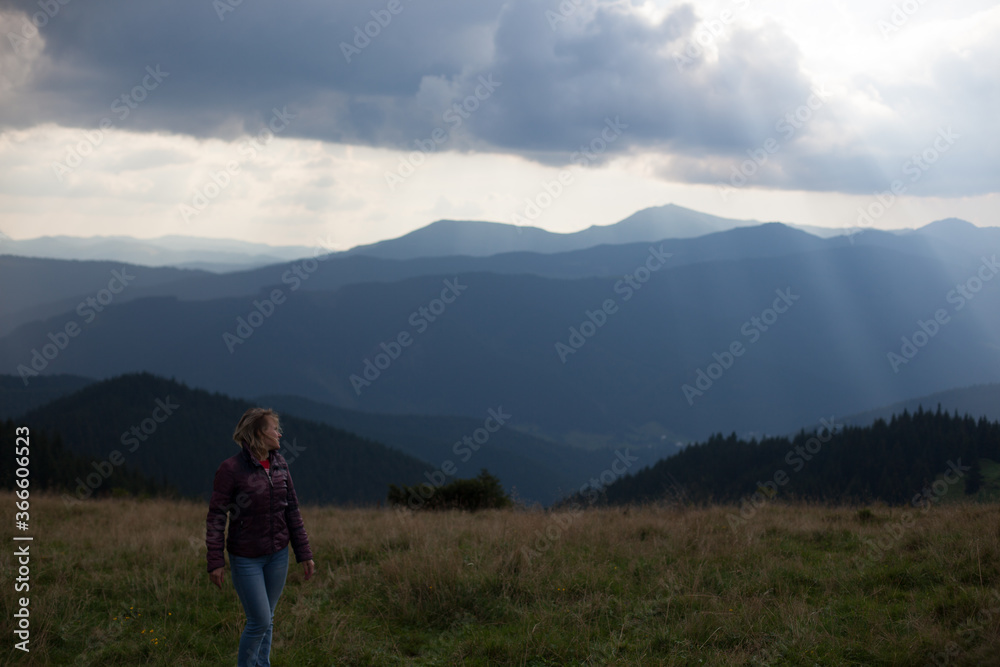 girl climbed to the top in the carpathian mountains