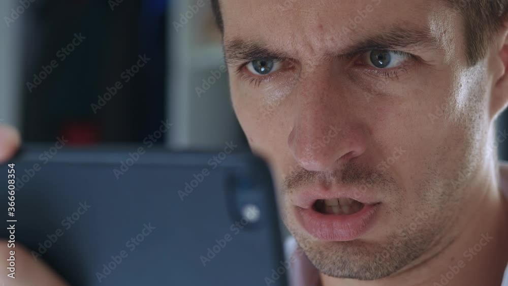 Angry troubled stressed business man having problem while using smartphone
