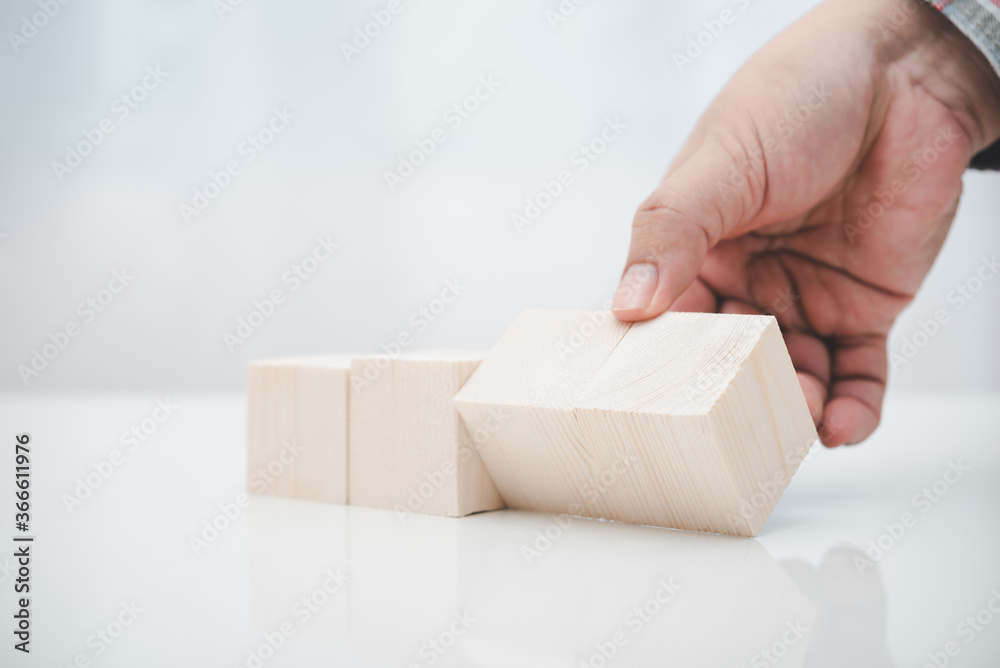 worker hand switch wood cube block worker hand switch wood cube block