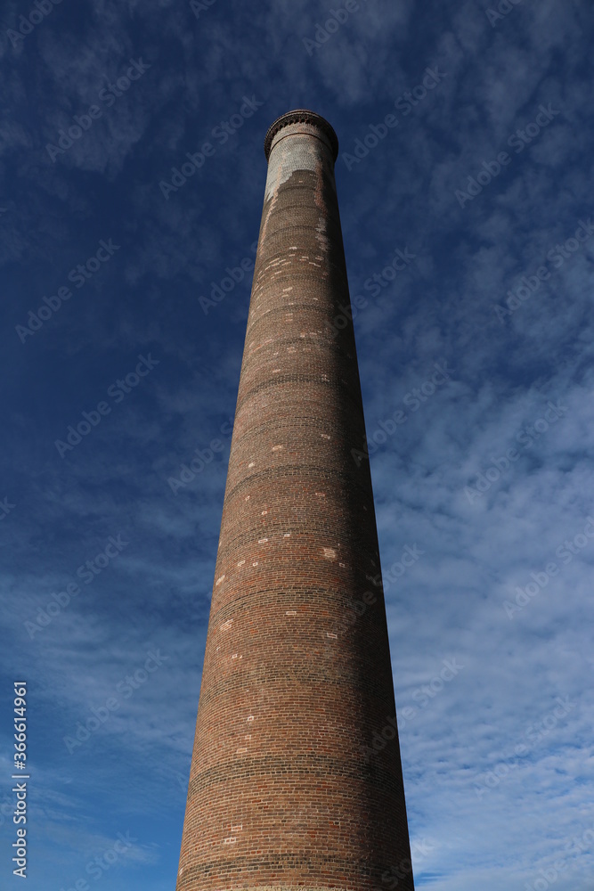 old brick chimney La Ramona on a blue sky at old mining town El Triunfo, Mexico 