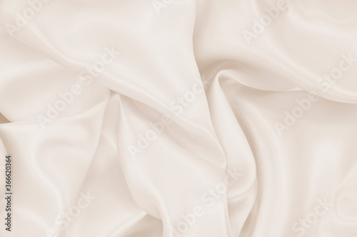 Smooth elegant golden silk or satin luxury cloth texture as wedding background. Luxurious background design. In Sepia toned. Retro style