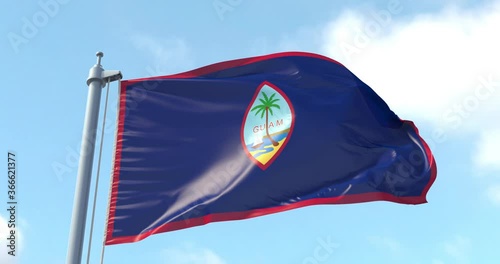 Guam flag on a flagpole waving in the wind in the sky. Wonderful intro for yor projects. Unincorporated territory of the United States in Micronesia in the western Pacific Ocean. Dededo. photo