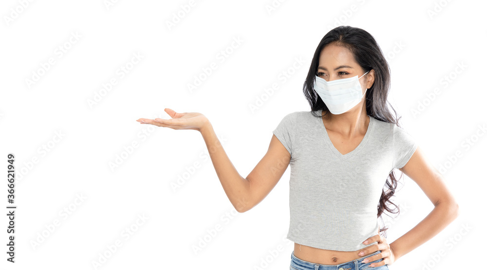 Isolated Happy Asian woman wearing a medical flu mask pointed fingers Isolated Happy Asian woman wearing a medical flu mask pointed fingers