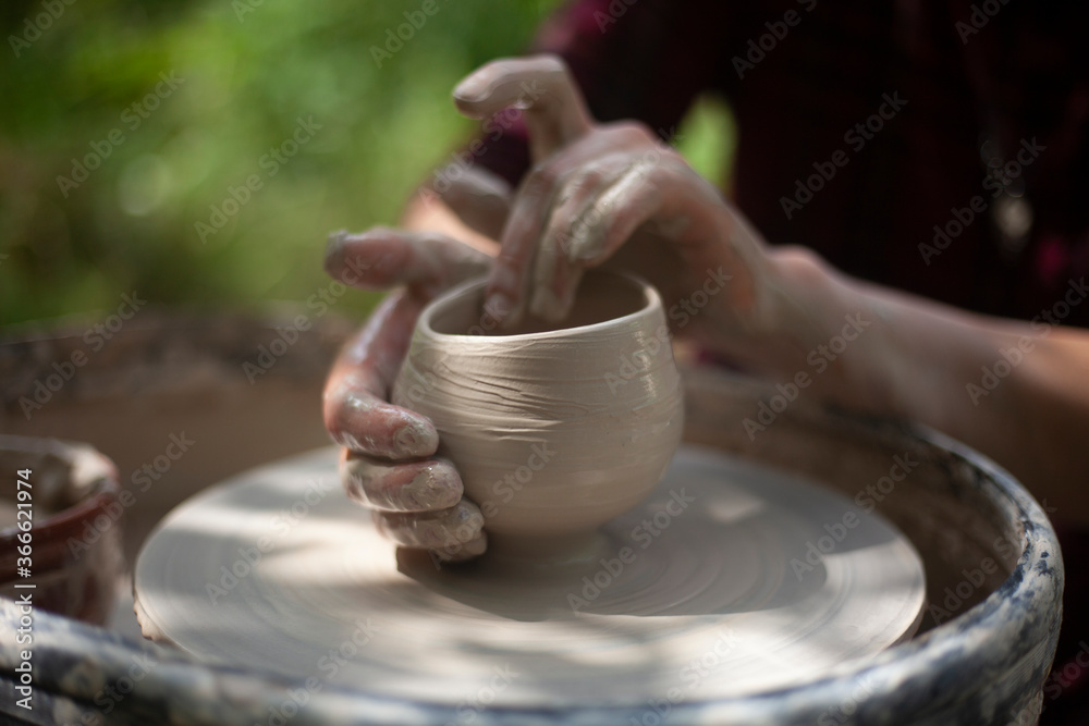 Potter at work. Hands sculpt clay. Creation of dishes. Potter at work. Hands sculpt clay. Creation of dishes.