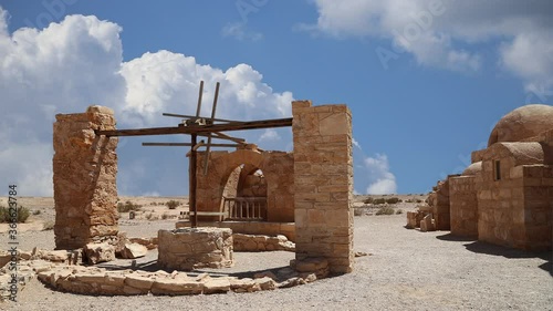 Quseir (Qasr) Amra desert castle near Amman, against the background of moving clouds, Jordan. World heritage with famous fresco's.   photo