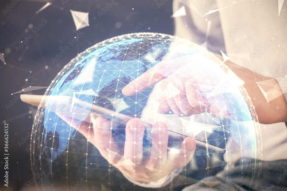 Double exposure of man's hands holding and using a phone and international business theme drawing. Double exposure of man's hands holding and using a phone and international business theme drawing.