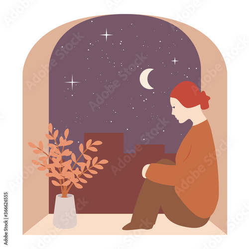 Girl sitting near a window, night starry sky in the background. Concept of loneliness, melancholy,  quarantine, sadness.