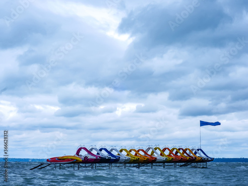 View on the water paddle bikes beach boats on the Balaton Lake