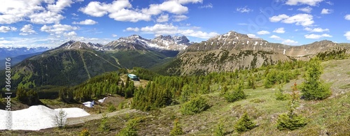 Wide Panoramic View of Lake Louise Chairlift and Ski Area with Scenic Alberta Summertime Mountain Landscape in Banff National Park, Canadian Rockies photo