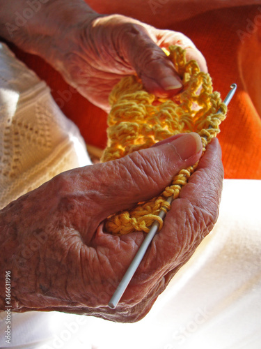  Old woman's hands knitting