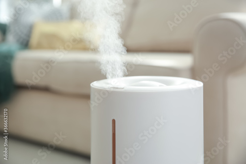 Modern air humidifier at home, closeup view photo