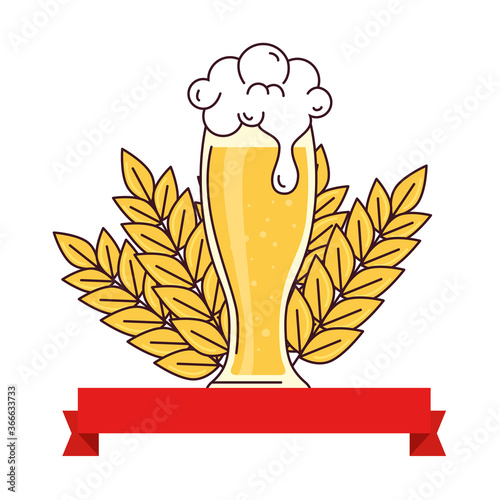 glass of beer with ribbon decoration and spike on white background