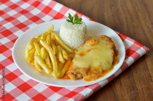 chicken parmigiana with rice and french fry