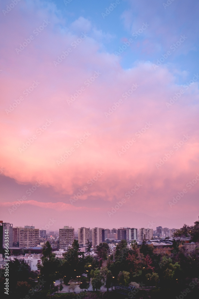 Beautiful and colorful cloudy sky over Santiago downtown with and Los Andes mountains, Chile